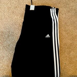 Adidas women’s size L track pants. Never worn. Excellent condition